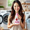 A happy Japanese woman holding a softener bottle with a pomegranate scent in her laundry room. The background features clean folded towels, a modern washing machine, and a bright and fresh atmosphere. The woman looks satisfied and pleased with the purchase.