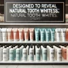 A stylish retail shelf featuring a display of toothpaste labeled 'designed to reveal natural tooth whiteness.' Various bottles are neatly arranged, showing where it's available for sale, with a focus on accessibility and availability in a clean, modern store environment.